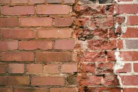 Broken or beat up bricks in wall. Stock Photos