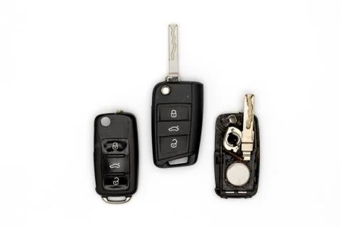 Broken or damaged remote key fob and new vehicle key on white background. Stock Photos