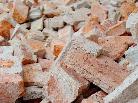 A broken orange brick with cement Stock Photos