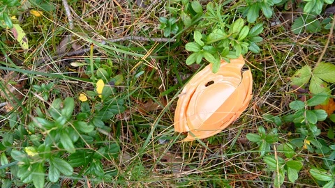 The broken orange coffee cup in the ground Stock Footage 122134410