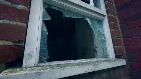 Broken Pane of Wire-Reinforced Window Glass in Vandalised Derelict Building Stock Footage 252504085
