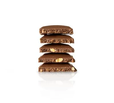 Broken parts of chocolate. vertical stack isolated on white Stock Photos