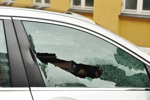 Broken passenger window, car theft Broken passenger window, car theft Copy... Stock Photos