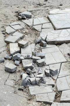 Broken pavements sidewalks on the sidewalk. pavement with paving slabs with d Stock Photos