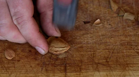 Broken peach stone with hammer Stock Footage 35712882