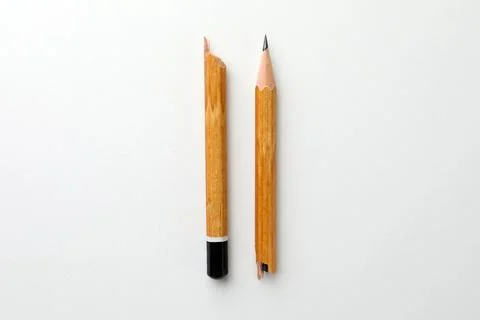 Broken pencil on white background, flat lay. Pause concept Stock Photos