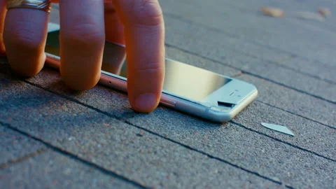 Broken phone on the ground. Broken device technique. Stock Footage 166921685