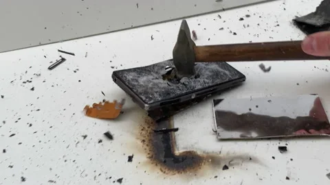 Broken phone. Hammer hitting the display breaks the mobile phone. Stock Footage 221138950