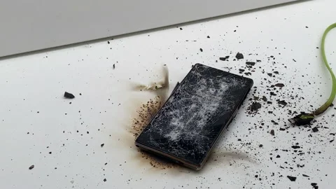 Broken phone. Hammer hitting the display breaks the mobile phone Stock Footage 221141193