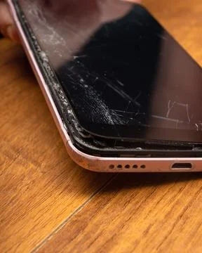 Broken phone screen closeup, broken glass smartphone. Stock-Fotos