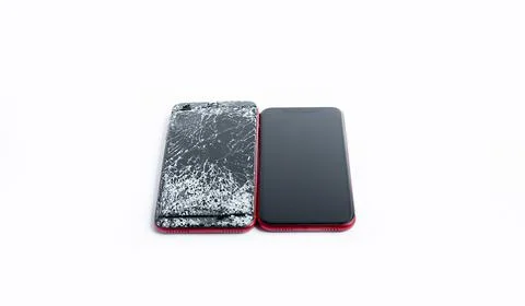 Broken phone on a white background, broken electronics Stock Photos