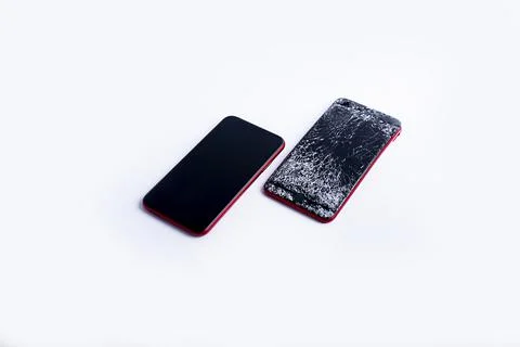 Broken phone on a white background, broken electronics Stock Photos