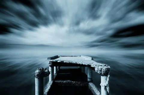 Broken pier of the harbor Stock Photos