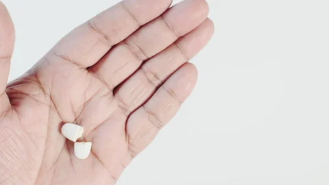 Broken Pill In a Hand Video stock 248776072