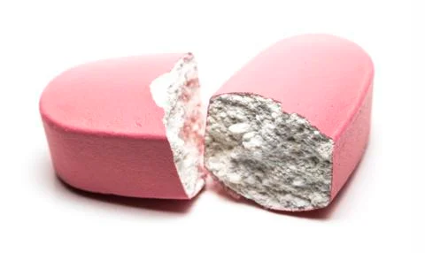Broken pill on a white background close-up Stock Photos