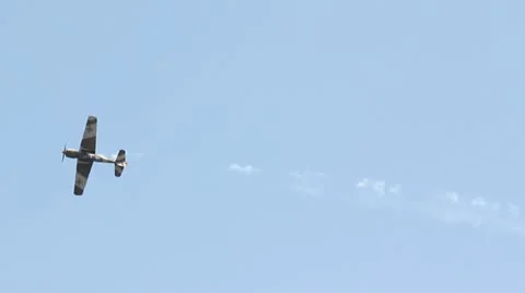 Broken plane falling down behind a tree Stock Footage 12273871