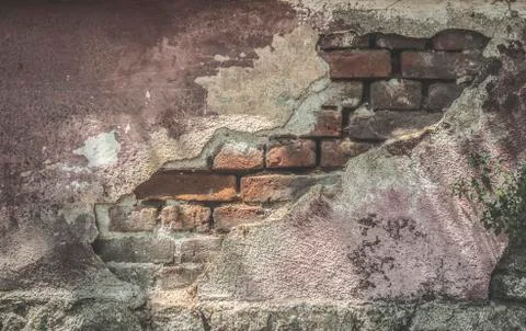 Broken plaster and brick wall Stock Photos