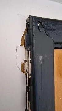 Broken plaster around a door frame Photos