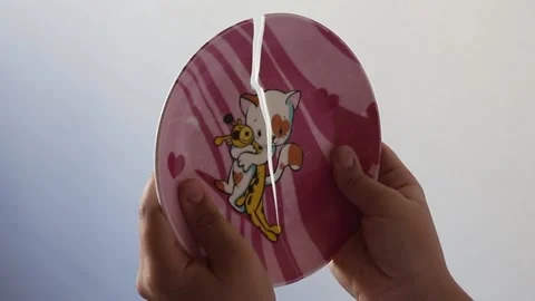 Broken plate in children hands Stock Footage 162587113