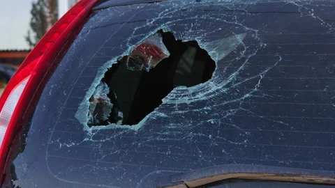 Broken rear car window showing expanding cracks Video stock 282966510