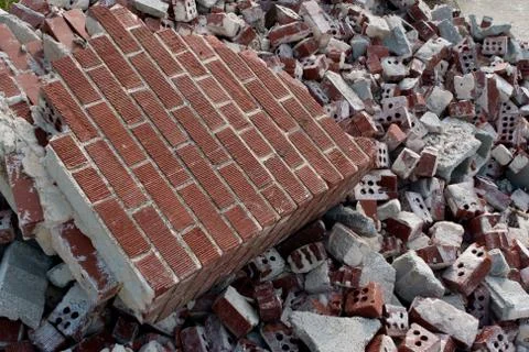 Broken Red Bricks Are Piled High At Demolition Site Stock Photos