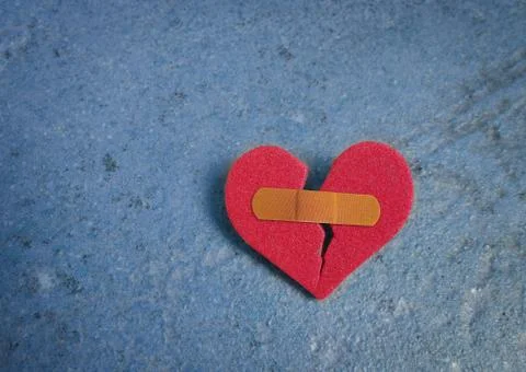 Broken red heart Stock Photos
