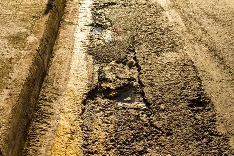 Broken road surface Stock Photos