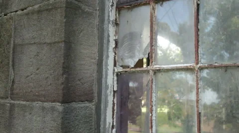 Broken rusted window on abandoned building Stock Footage 67406871