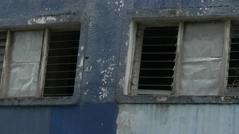 Broken rustic window of abandoned building near Sudi Mampir market Stock Footage 156996977