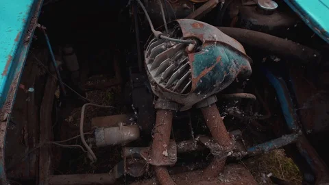 A broken rusty engine of a strange old sea-green car. Stock Footage 114326049
