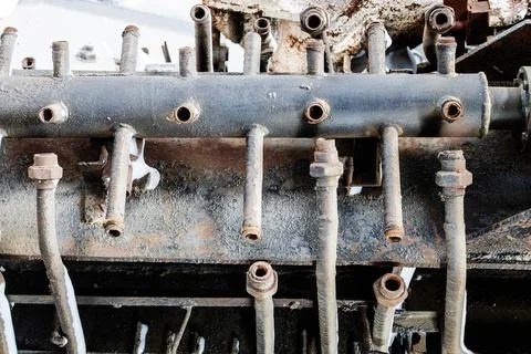 Broken rusty pipe device in abandoned workshop Stock Photos