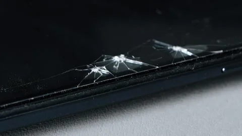 Broken screen protector on modern smartphone device, close-up view damage, Stock Footage 344846619