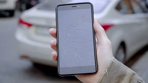 Broken screen on a smartphone in a man's hand Stock Footage 160157554