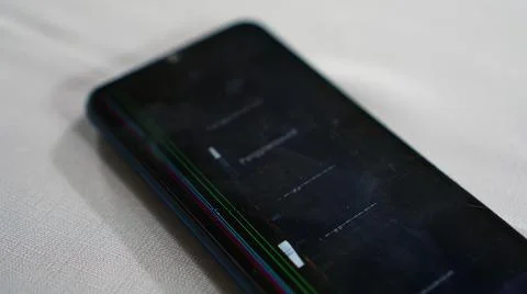 The broken screen of the smartphone is on the table. Selective focus. 스톡 사진