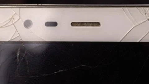 Broken screen of a white smartphone. Macro video slider Stock Footage 152555542