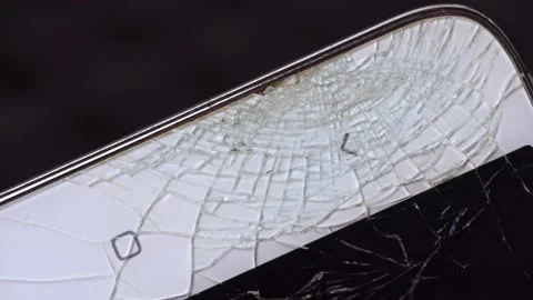 Broken screen of a white smartphone. Macro video slider Stock Footage 152556395