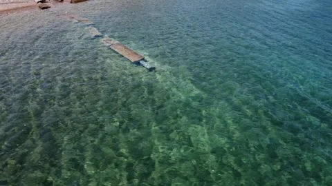 Broken sewage pipe visible under clear Mediterranean sea Video stock 319748608