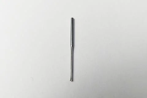 Broken Sewing Machine Needle on a white background Stock Photos
