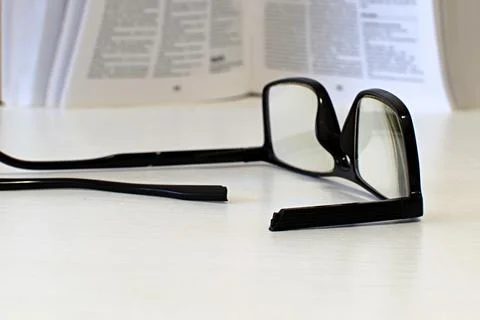 Broken side piece of glasses close up Stock Photos