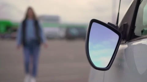 Broken off side rearview mirror on car. White auto on parking after accident. 動画素材 161037819
