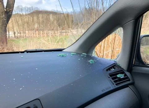 Broken side window of a car. Attempt to steal things inside the car. Stock Photos