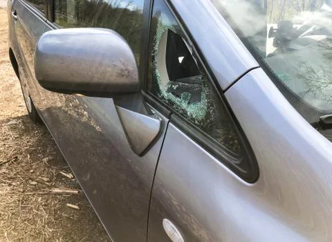 Broken side window of a car.  Stock Photos