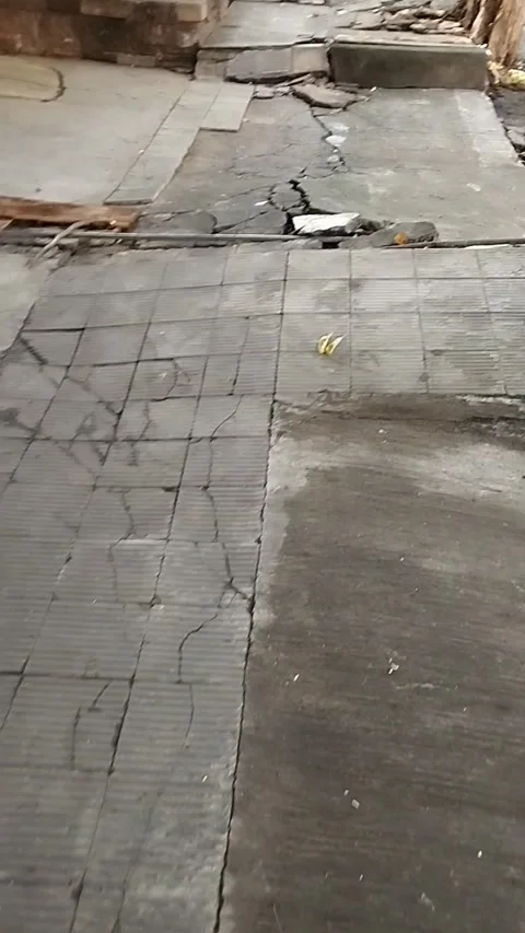 Broken sidewalk road view Stock Footage 226727999