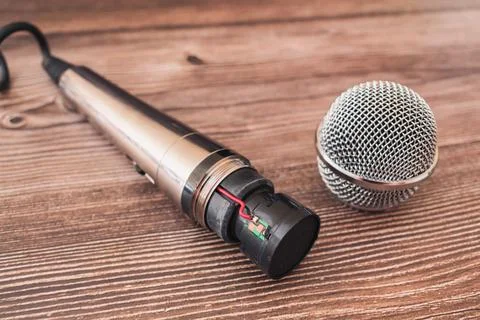 Broken singing microphone disassembled under repair Stock Photos