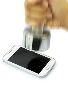 Broken smart phone smashed by dumbbell. Stock Photos