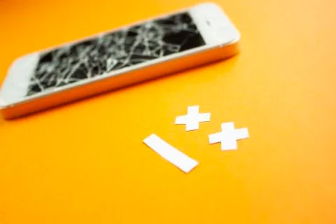 Broken smartphone with cracked destroyed screen Stock Photos