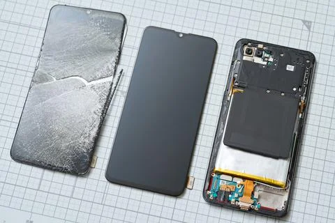 Broken smartphone display and replacement parts Stock Photos