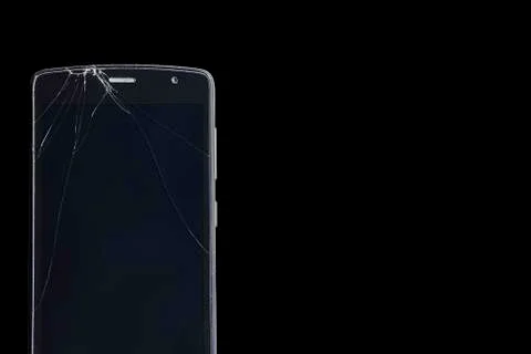Broken smartphone screen on a black background Stock Photos