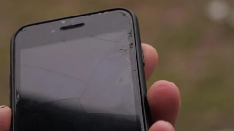 Broken smartphone screen protector close up Stock Footage 299624863