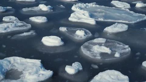 Broken spring ice swaying on the sea surface Stock Footage 149305414